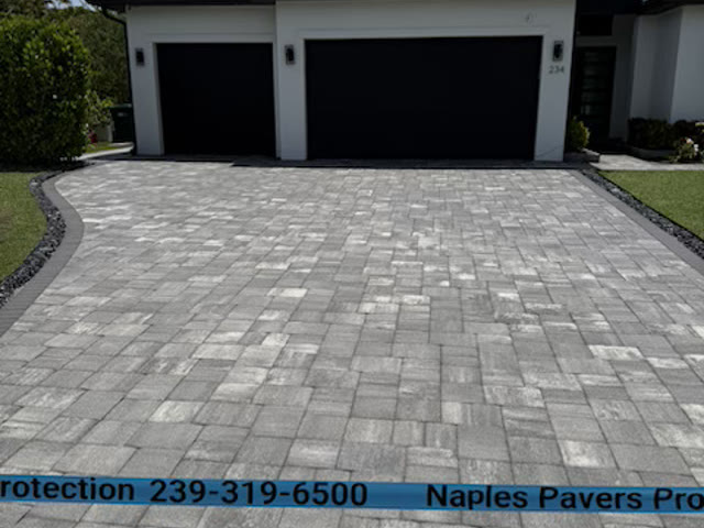 A Naples driveway taped off and coned while the sealer cures