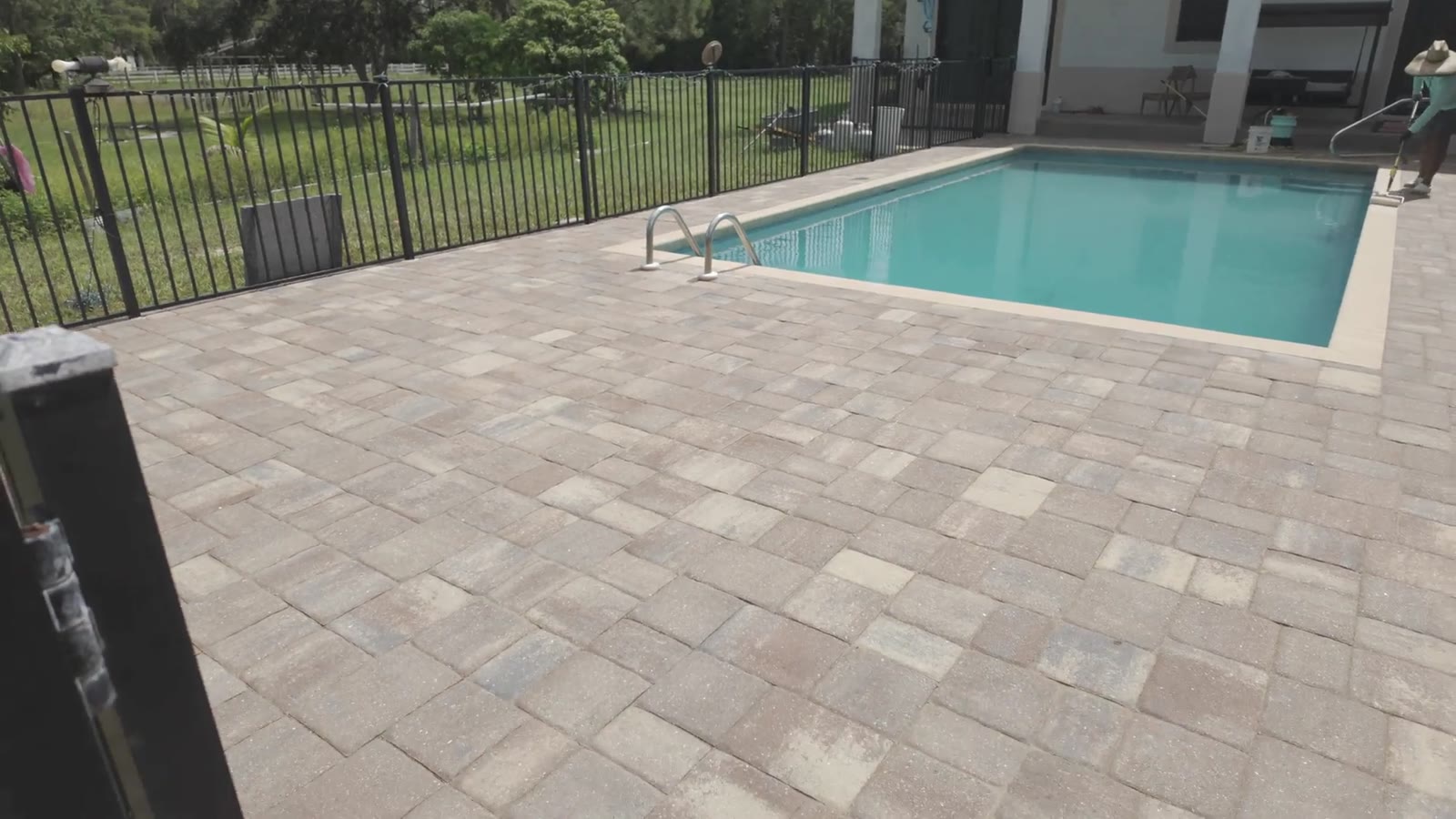 A paver pool deck in Naples with the color brought back into the stone