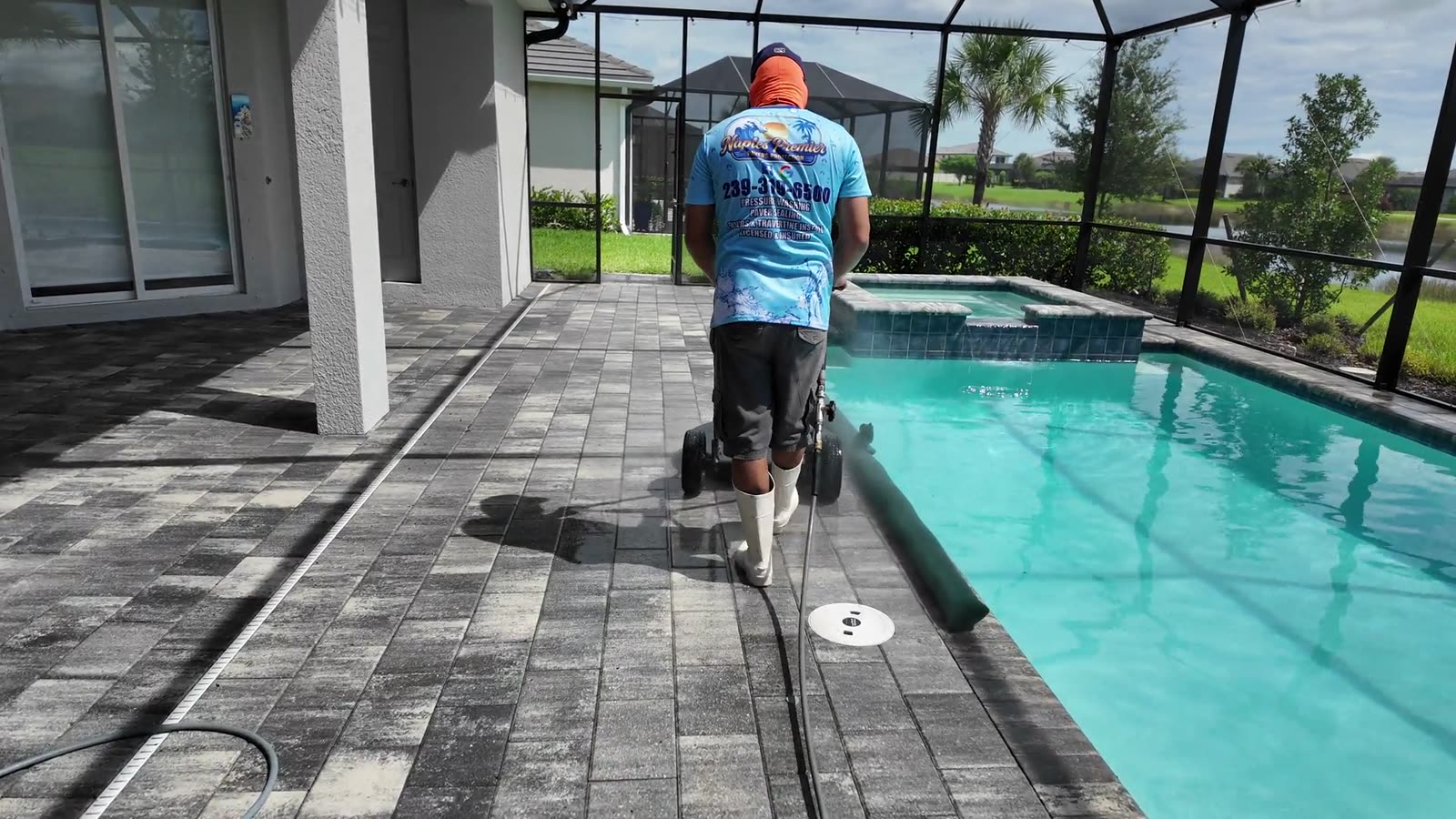A screened pool deck in Naples after a soft wash