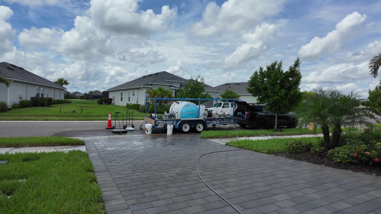 The Naples Premier Pavers Protection rig parked on a finished paver driveway in Naples